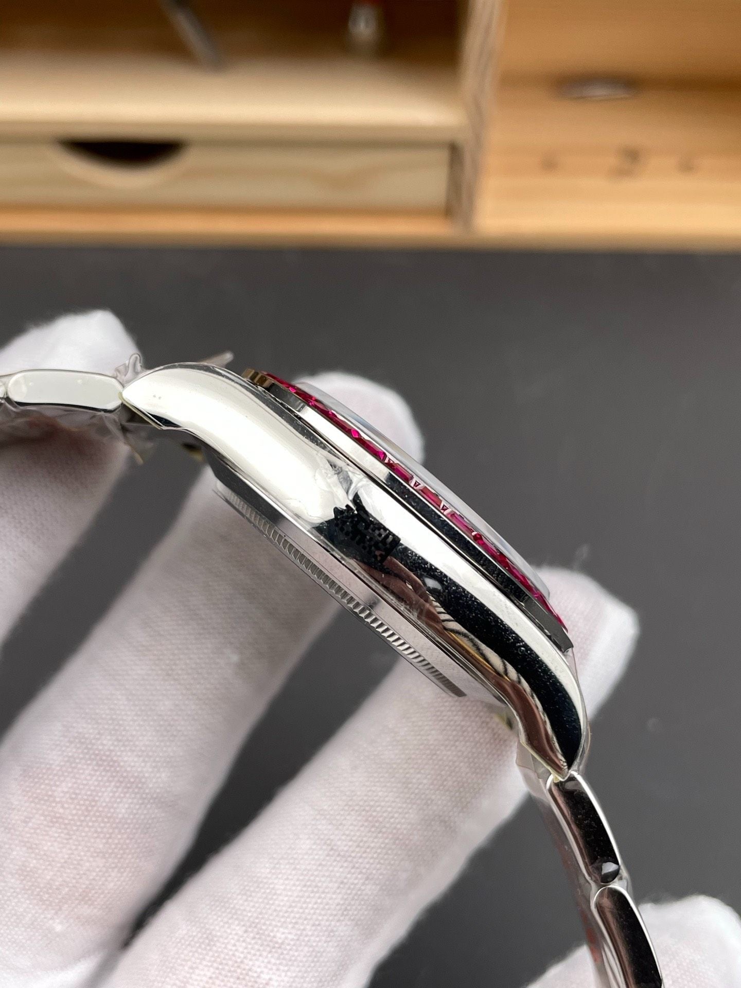 Rolex Cosmograph Daytona 126599TRU – 18k White Gold with Ruby Bezel & Diamond Lugs