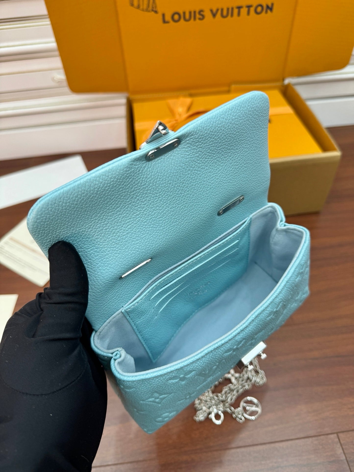 Louis Vuitton Nano Madeleine bag in the Azur Frost color in Monogram Empreinte leather.