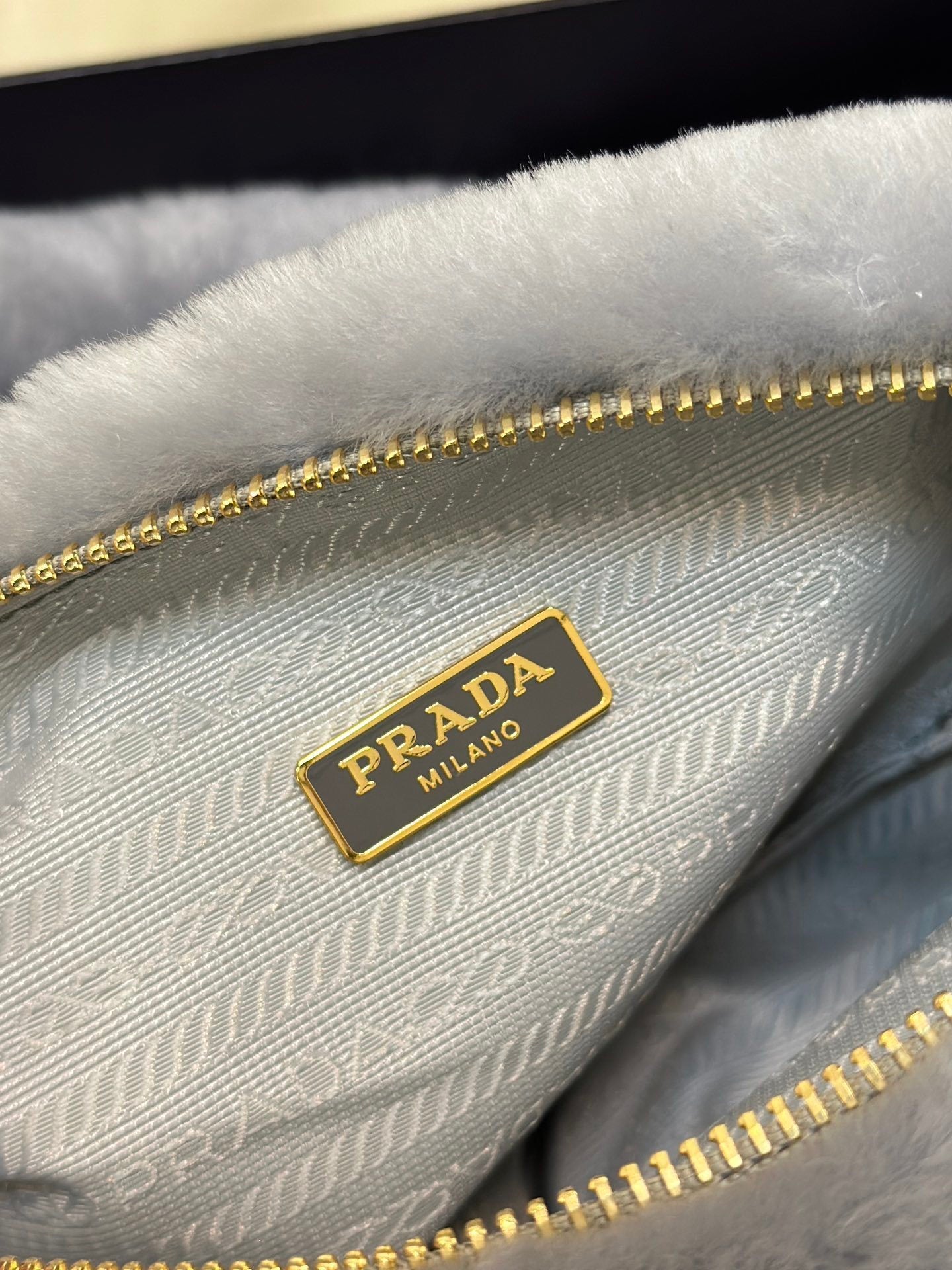 Prada Re-Edition Mini Shearling Triangle Crossbody Bag – Grey
