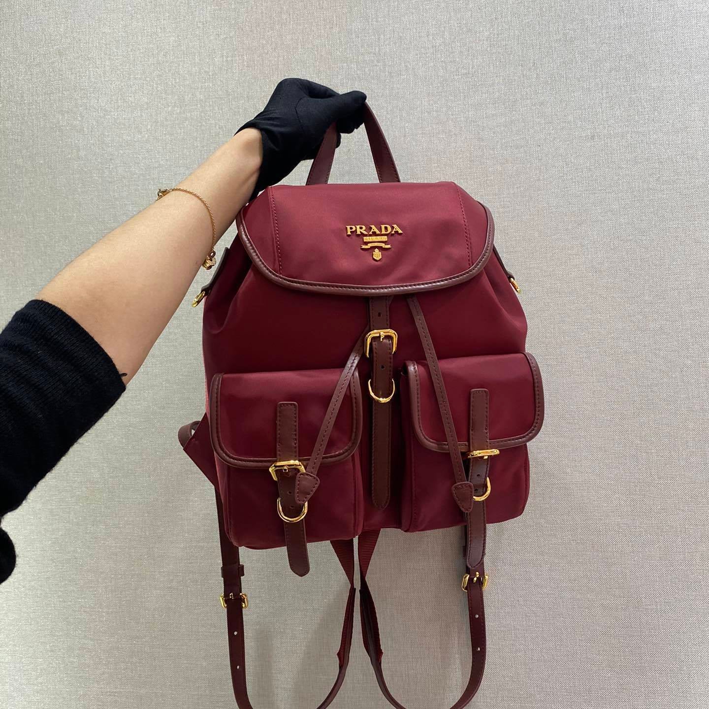 Prada Small Re-Nylon Backpack – Burgundy Red with Saffiano Leather Trim & Gold-Tone Hardware