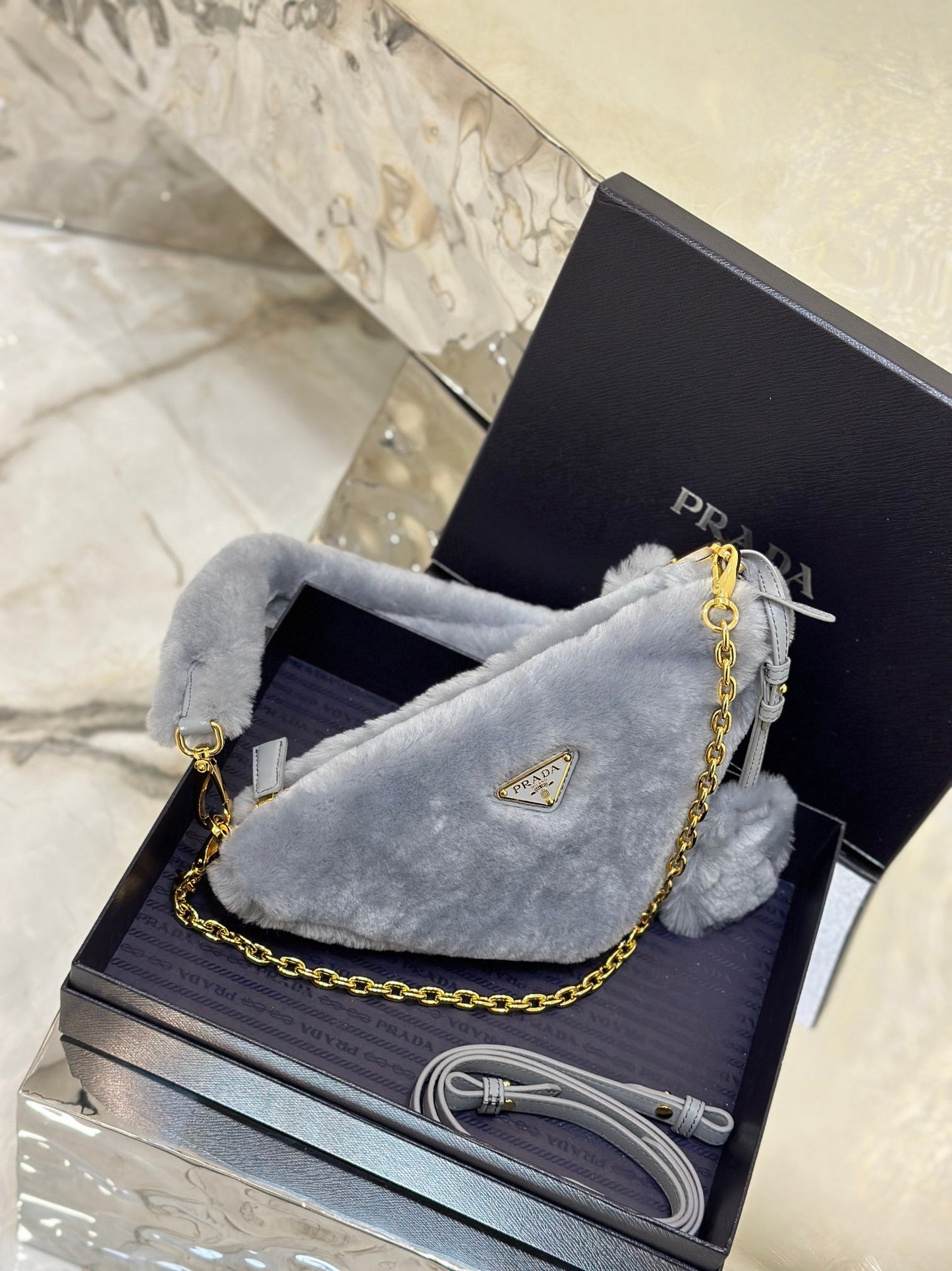Prada Re-Edition Mini Shearling Triangle Crossbody Bag – Grey