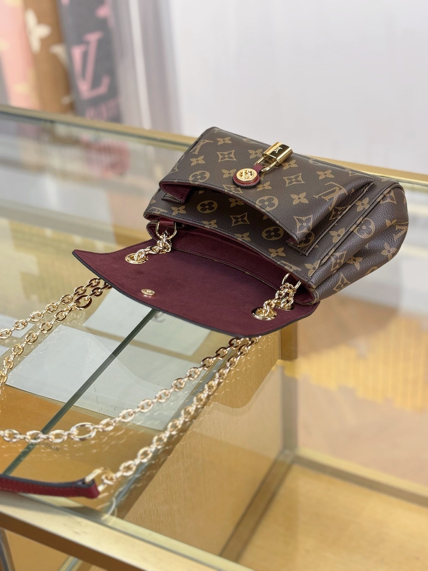 Louis Vuitton Saint Germain BB Bag in Monogram Canvas with Red Leather Trim & Gold Chain Padlock