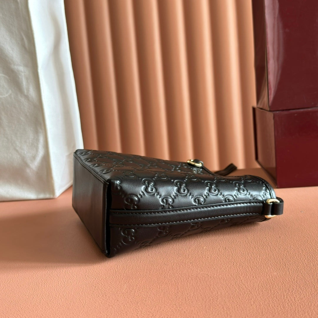 Gucci Small GG Emblem Bucket Bag in Black Embossed Leather with Dog Charm