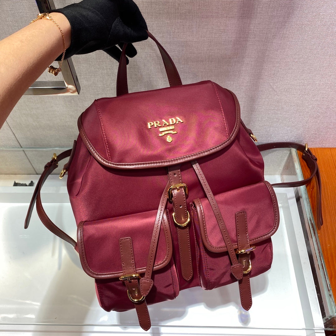 Prada Small Re-Nylon Backpack – Burgundy Red with Saffiano Leather Trim & Gold-Tone Hardware