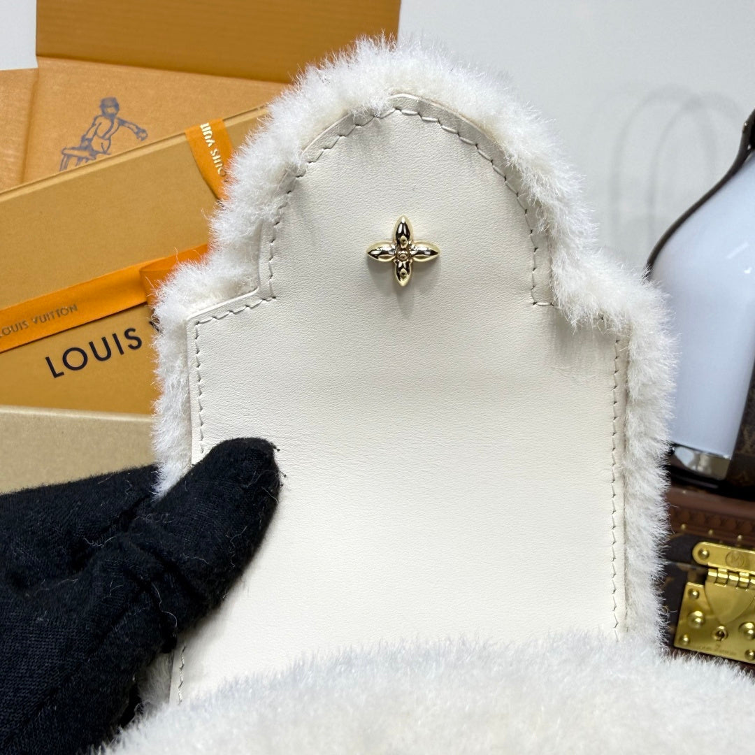 Louis Vuitton Capusnow Top-Handle Bag in Shearling with Removable Pompom Charm