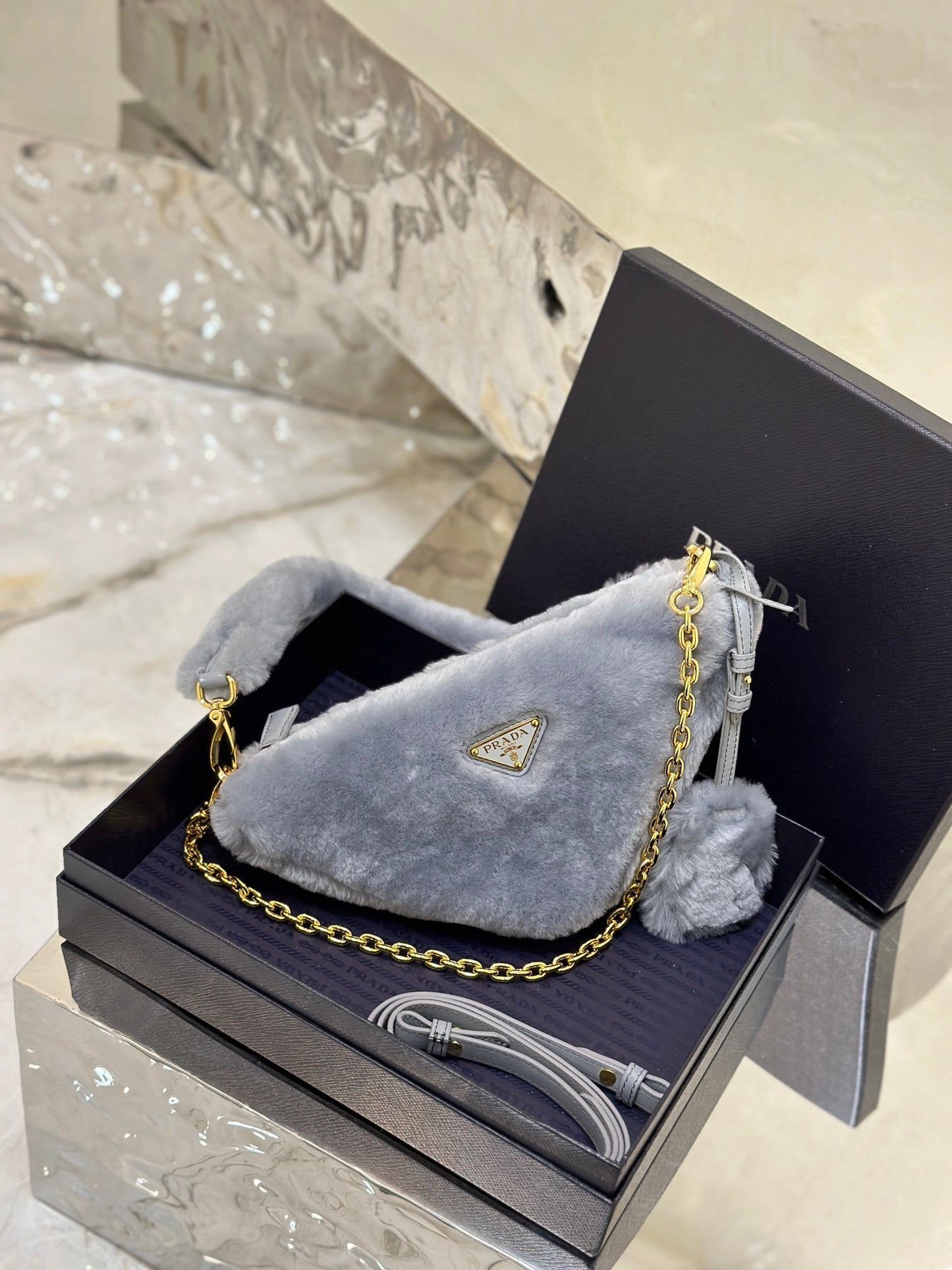 Prada Re-Edition Mini Shearling Triangle Crossbody Bag – Grey