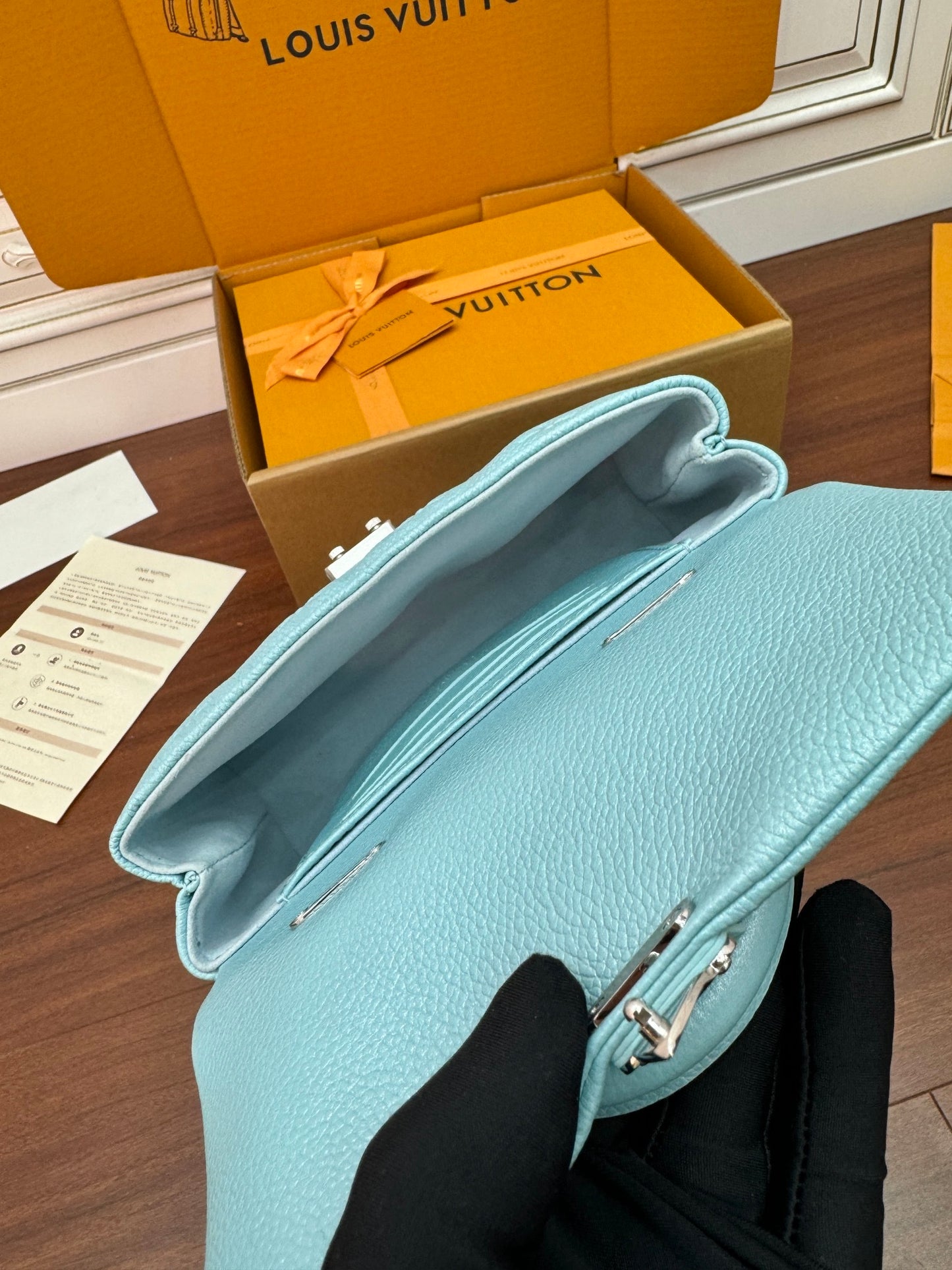 Louis Vuitton Nano Madeleine bag in the Azur Frost color in Monogram Empreinte leather.