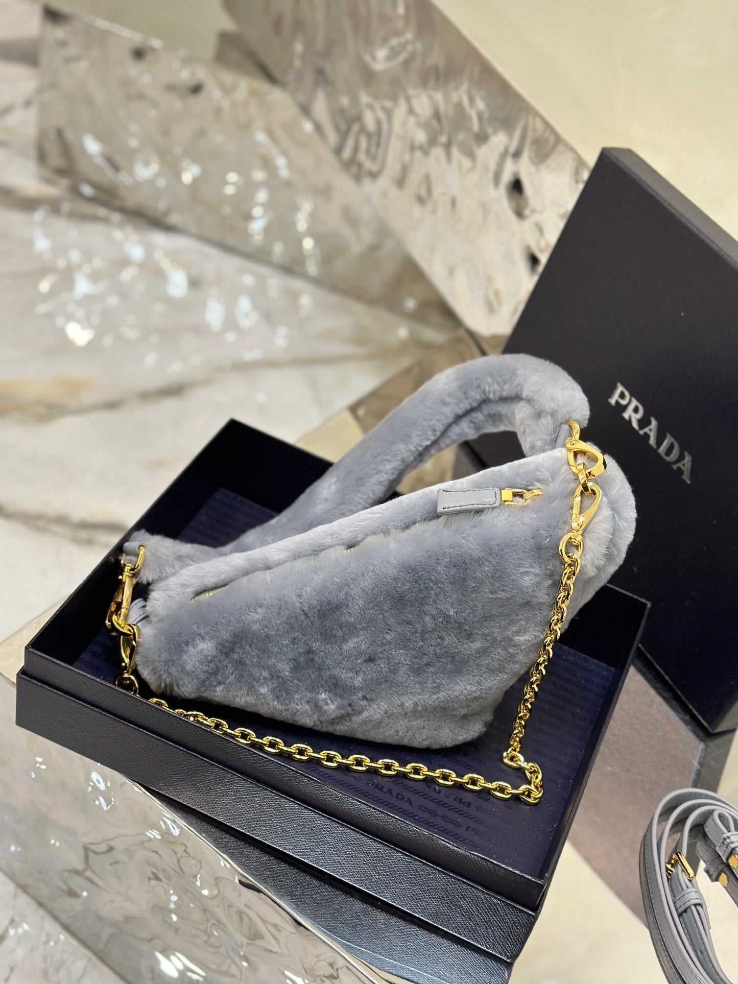 Prada Re-Edition Mini Shearling Triangle Crossbody Bag – Grey