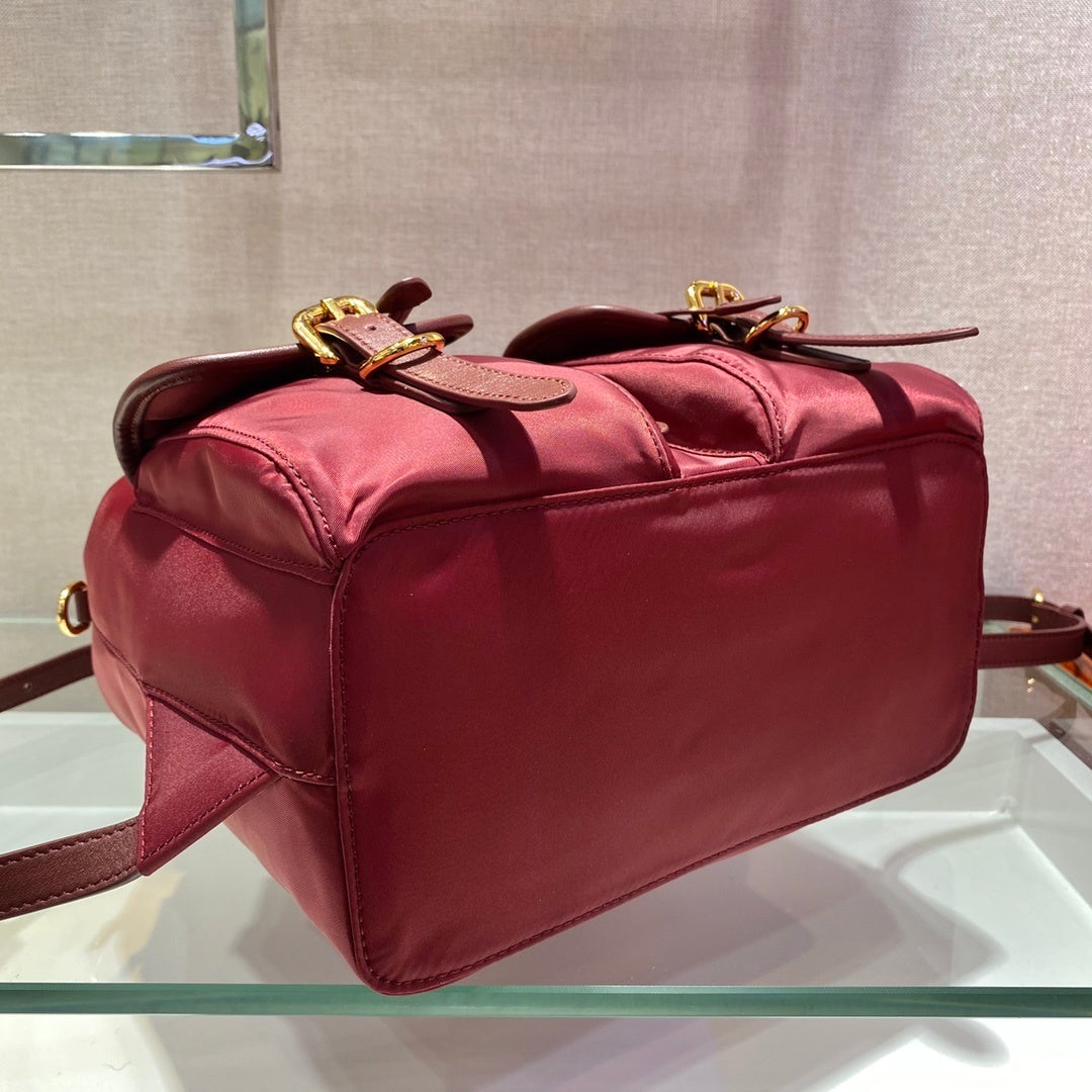 Prada Small Re-Nylon Backpack – Burgundy Red with Saffiano Leather Trim & Gold-Tone Hardware