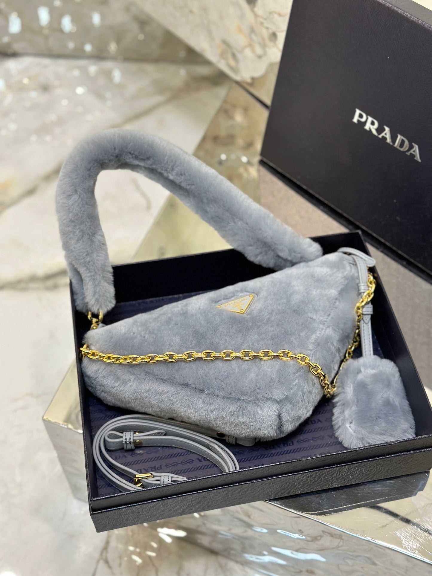 Prada Re-Edition Mini Shearling Triangle Crossbody Bag – Grey