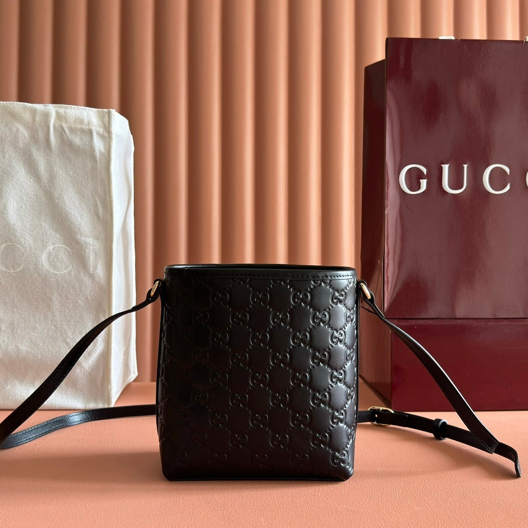 Gucci Small GG Emblem Bucket Bag in Black Embossed Leather with Dog Charm