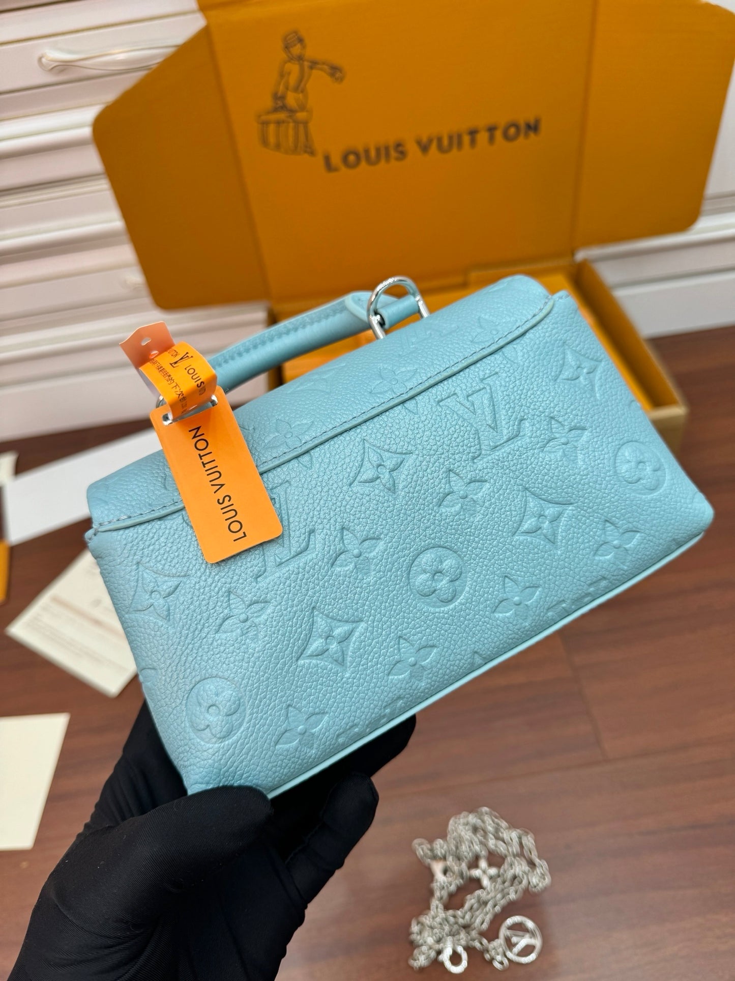 Louis Vuitton Nano Madeleine bag in the Azur Frost color in Monogram Empreinte leather.