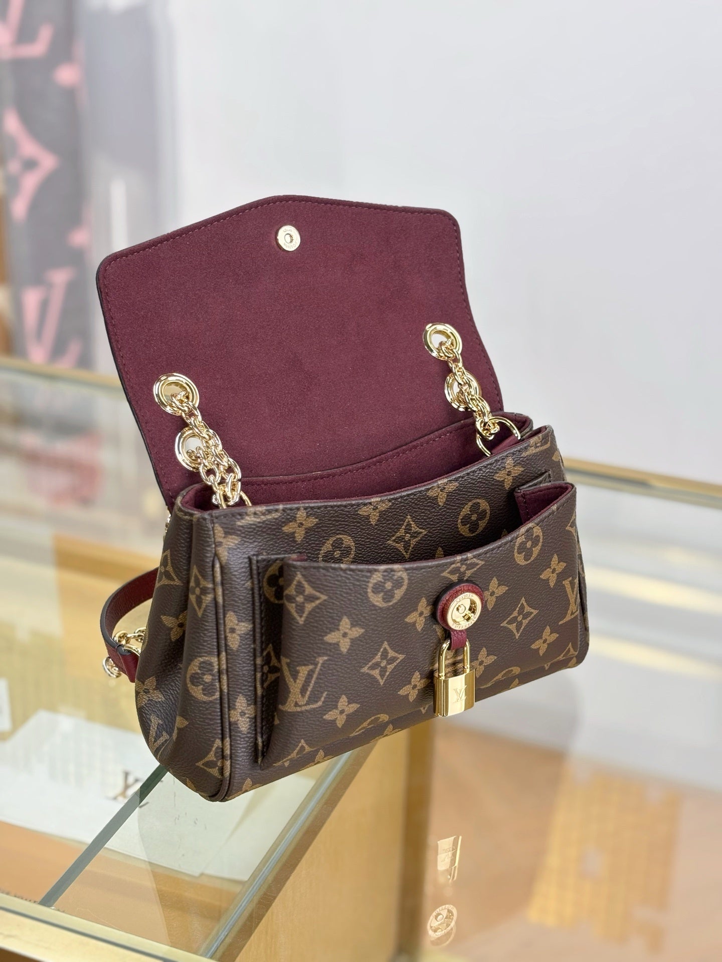 Louis Vuitton Saint Germain BB Bag in Monogram Canvas with Red Leather Trim & Gold Chain Padlock