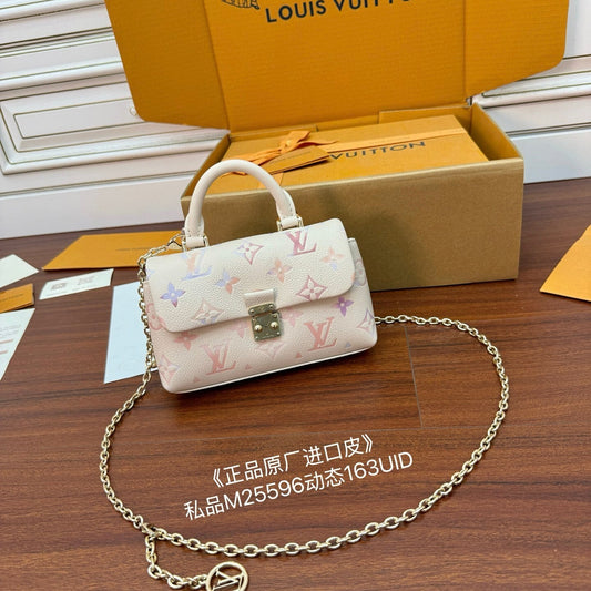 Louis Vuitton Nano Madeleine bag in the seasonal Snowy Pearl colorway, crafted from Monogram Empreinte leather.