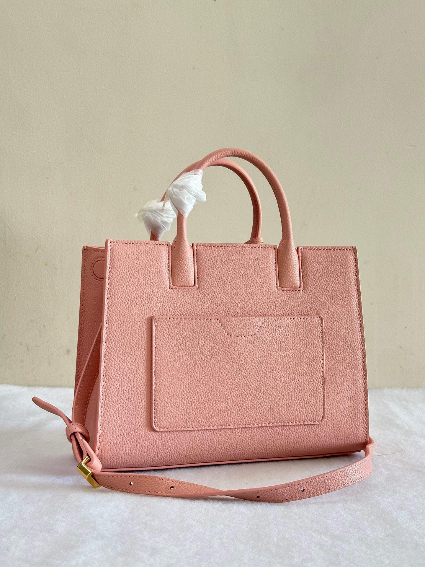 This is a Burberry Mini Frances Bag in dusky pink grainy leather, featuring the Thomas Burberry monogram in gold-tone hardware.