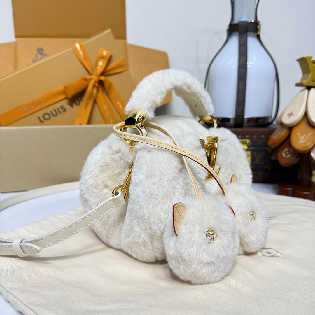 Louis Vuitton Capusnow Top-Handle Bag in Shearling with Removable Pompom Charm