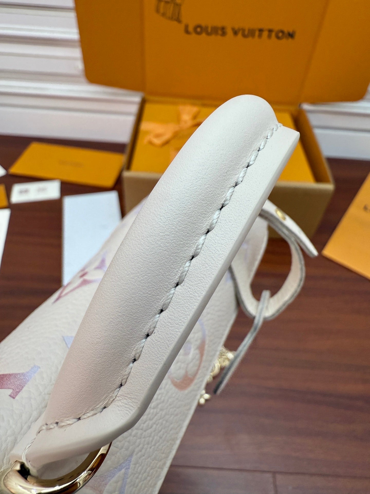 Louis Vuitton Nano Madeleine bag in the seasonal Snowy Pearl colorway, crafted from Monogram Empreinte leather.