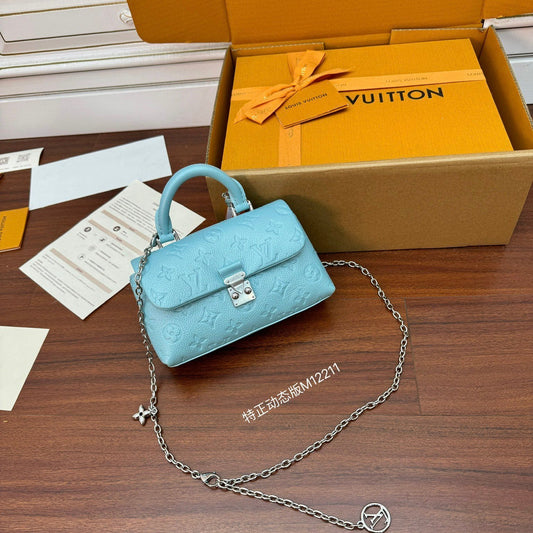 Louis Vuitton Nano Madeleine bag in the Azur Frost color in Monogram Empreinte leather.