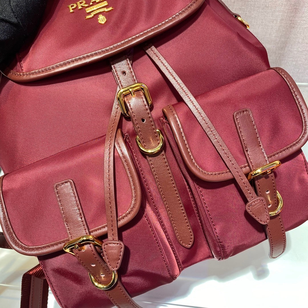 Prada Small Re-Nylon Backpack – Burgundy Red with Saffiano Leather Trim & Gold-Tone Hardware