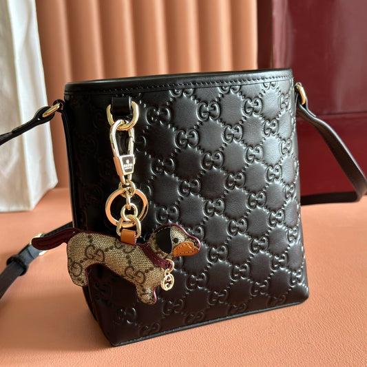 Gucci Small GG Emblem Bucket Bag in Black Embossed Leather with Dog Charm