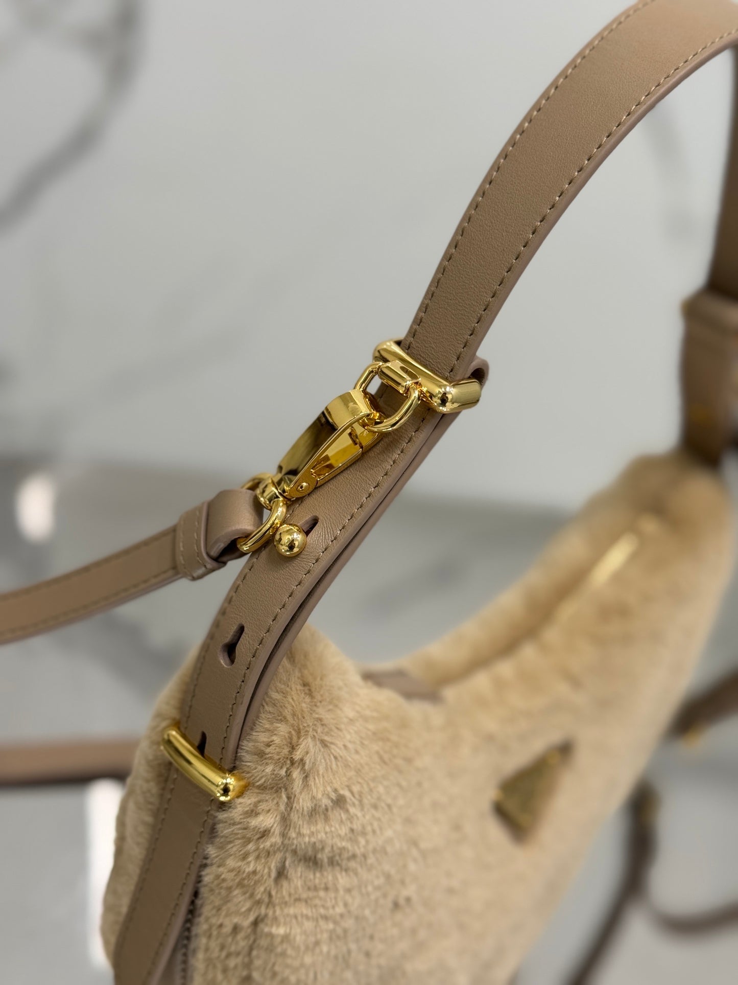 Prada Arqué Shearling Shoulder Bag – Leather Trim with Enamel Triangle Logo