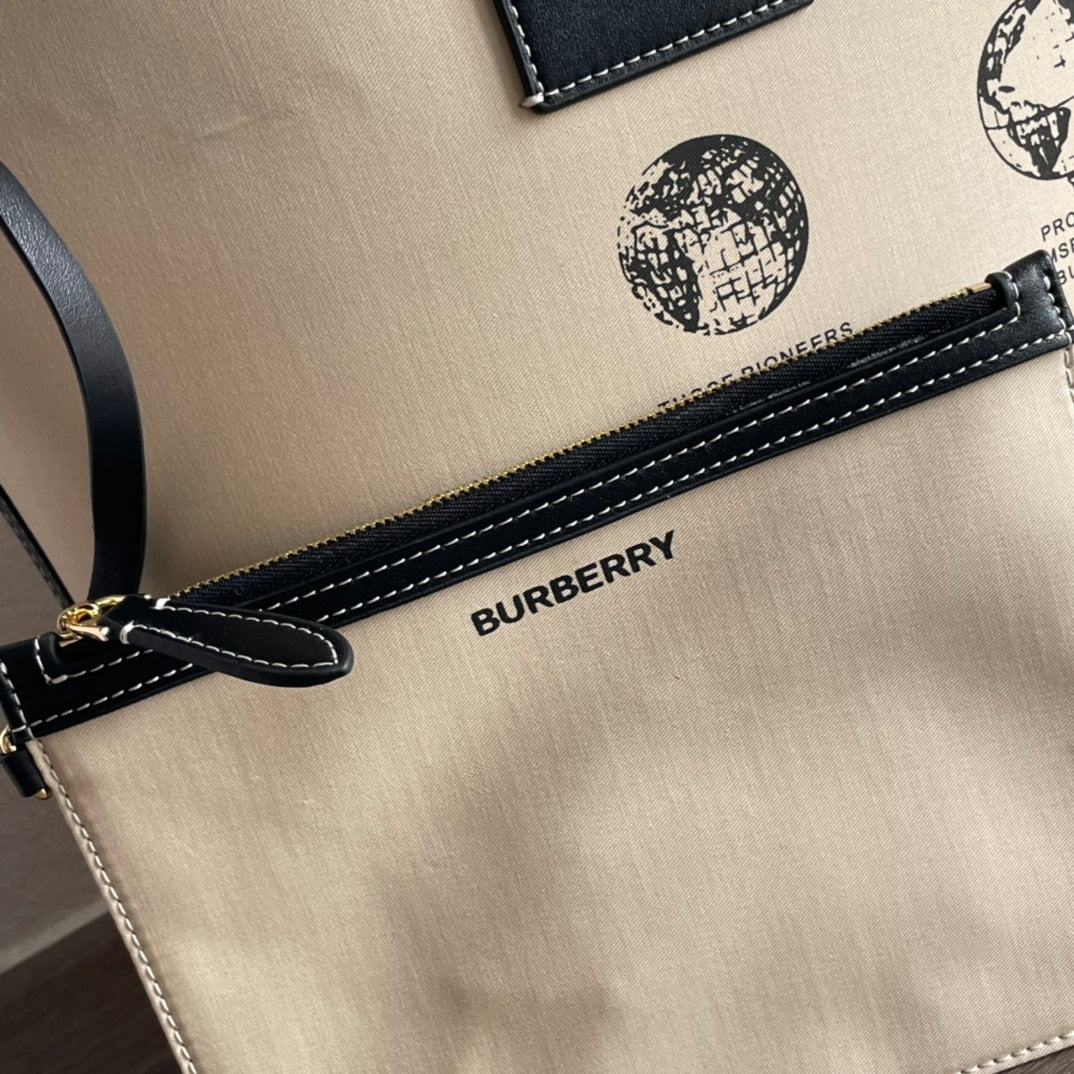 Burberry Label Print Cotton Medium London Tote Bag in beige and black, featuring leather trim and contrast stitching