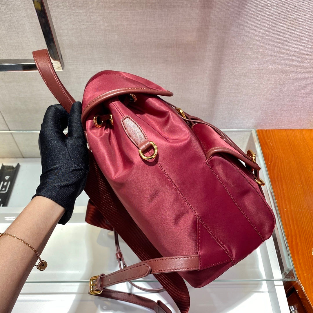 Prada Small Re-Nylon Backpack – Burgundy Red with Saffiano Leather Trim & Gold-Tone Hardware
