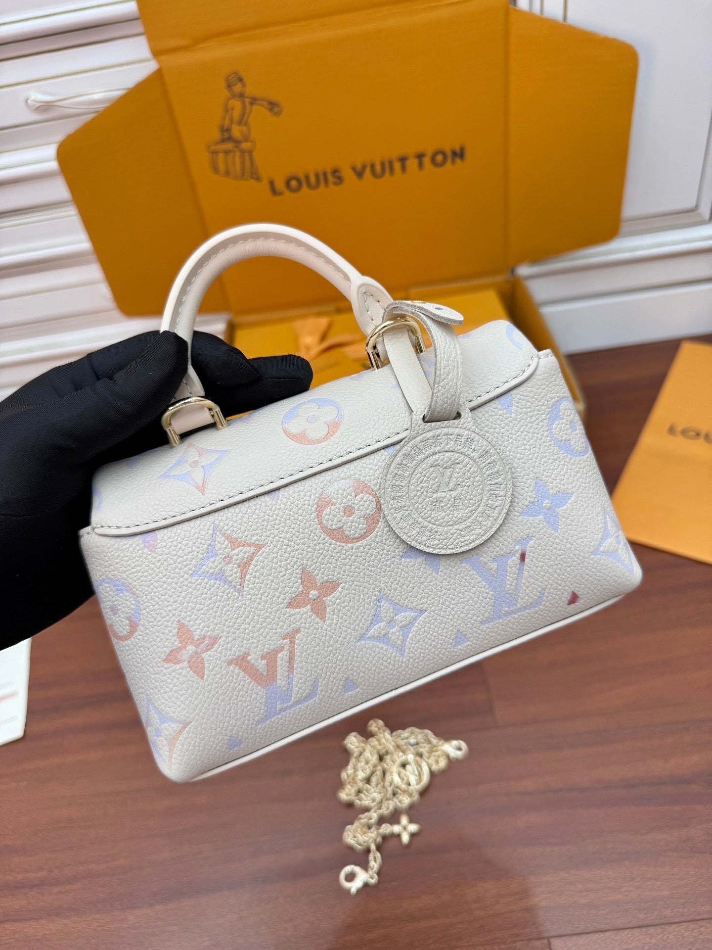 Louis Vuitton Nano Madeleine bag in the seasonal Snowy Pearl colorway, crafted from Monogram Empreinte leather.