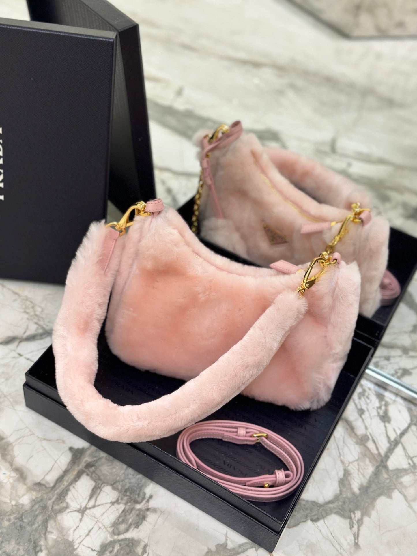 Prada Re-Edition Shearling Mini Bag – Pink with Gold-Tone Chain Strap & Enamel Logo