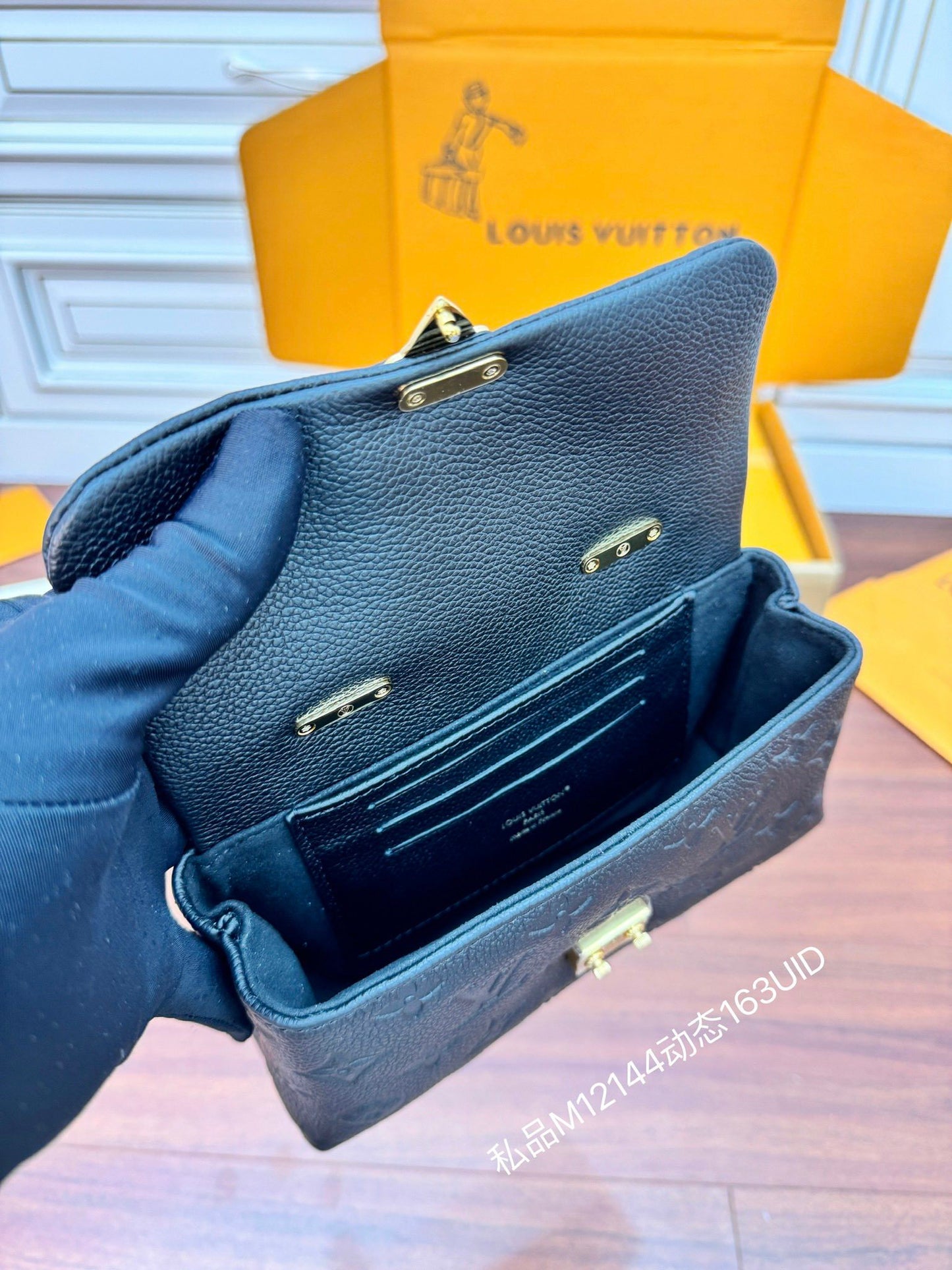 Louis Vuitton Nano Madeleine Bag in Black Monogram Empreinte Leather