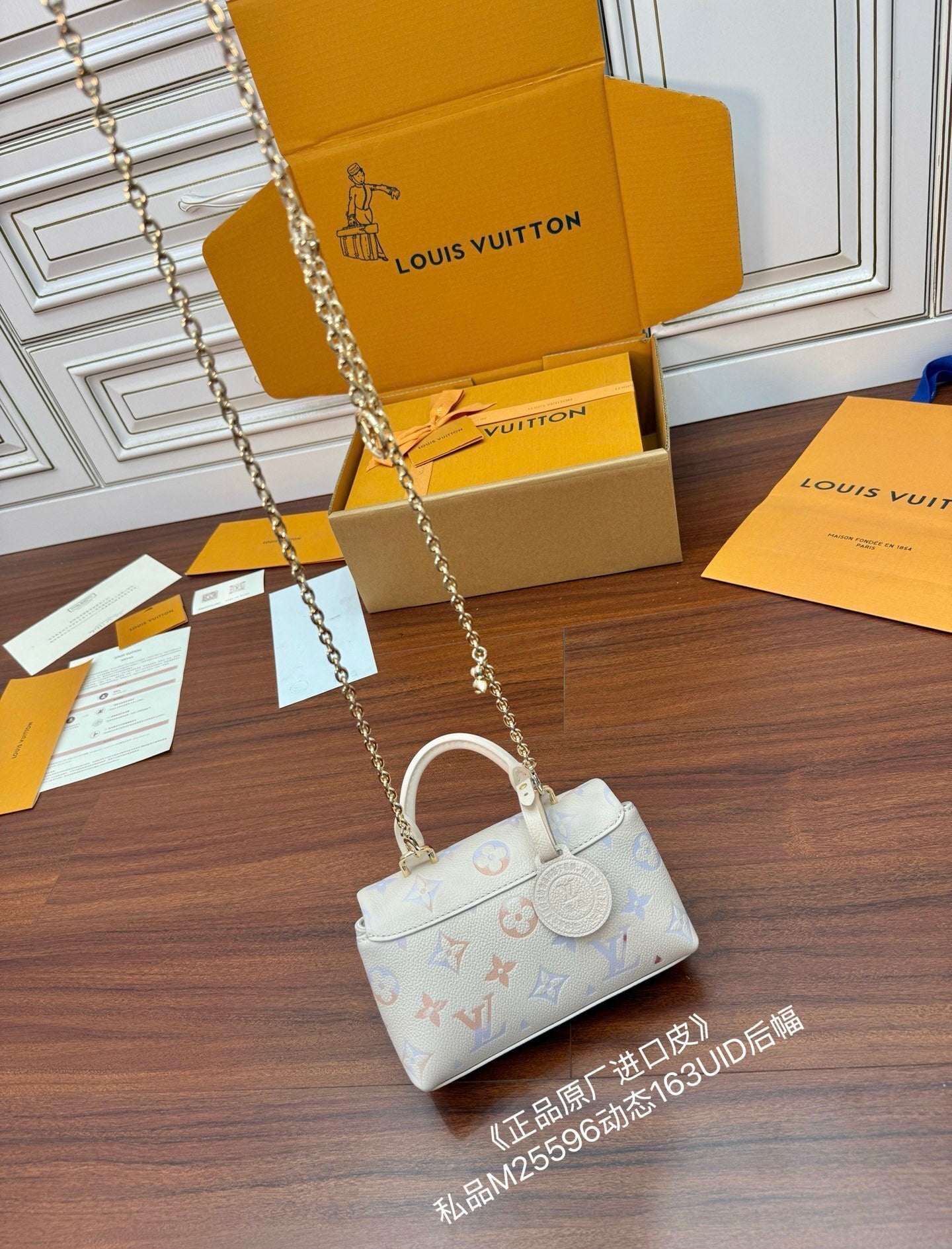 Louis Vuitton Nano Madeleine bag in the seasonal Snowy Pearl colorway, crafted from Monogram Empreinte leather.