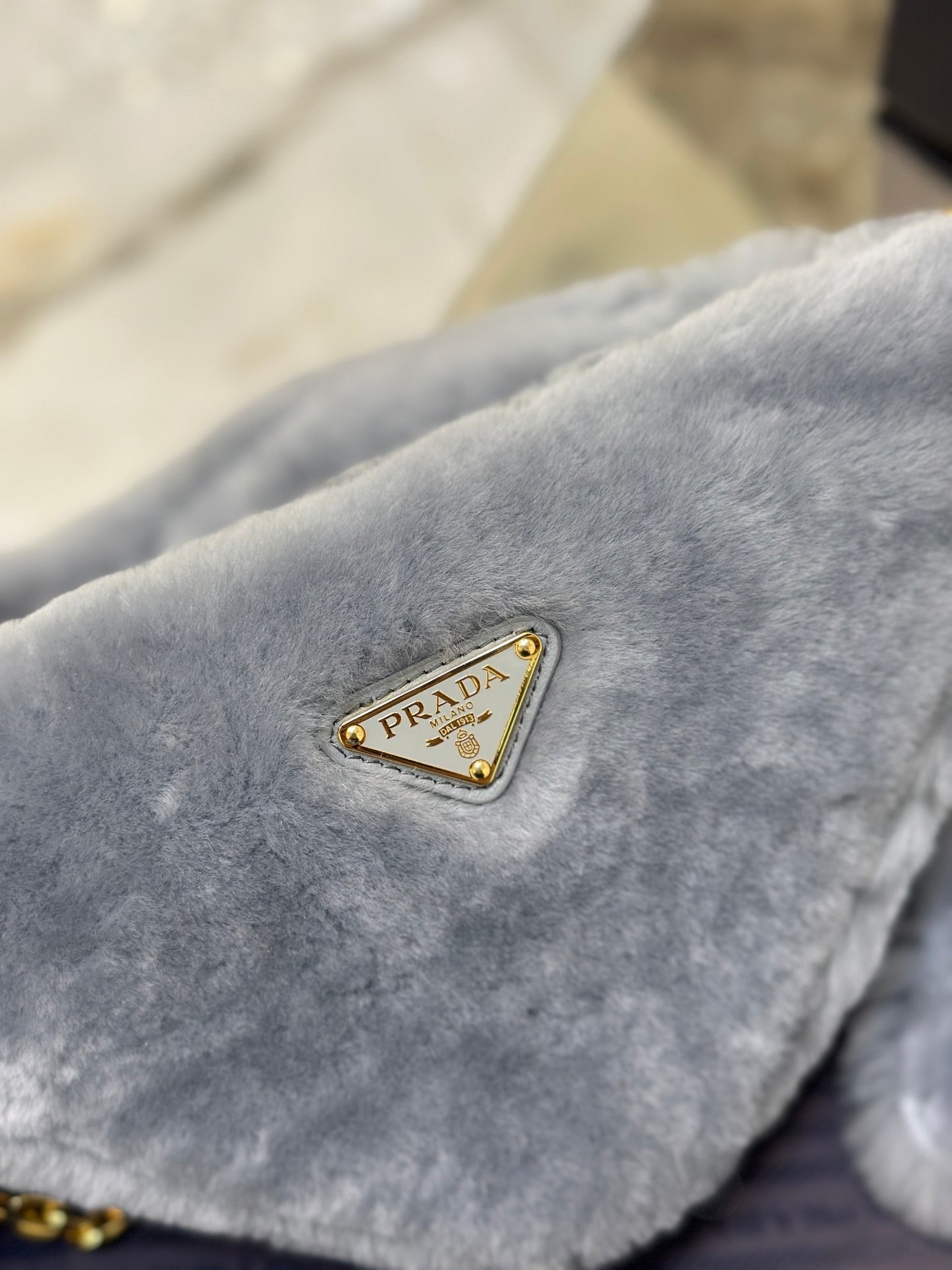 Prada Re-Edition Mini Shearling Triangle Crossbody Bag – Grey