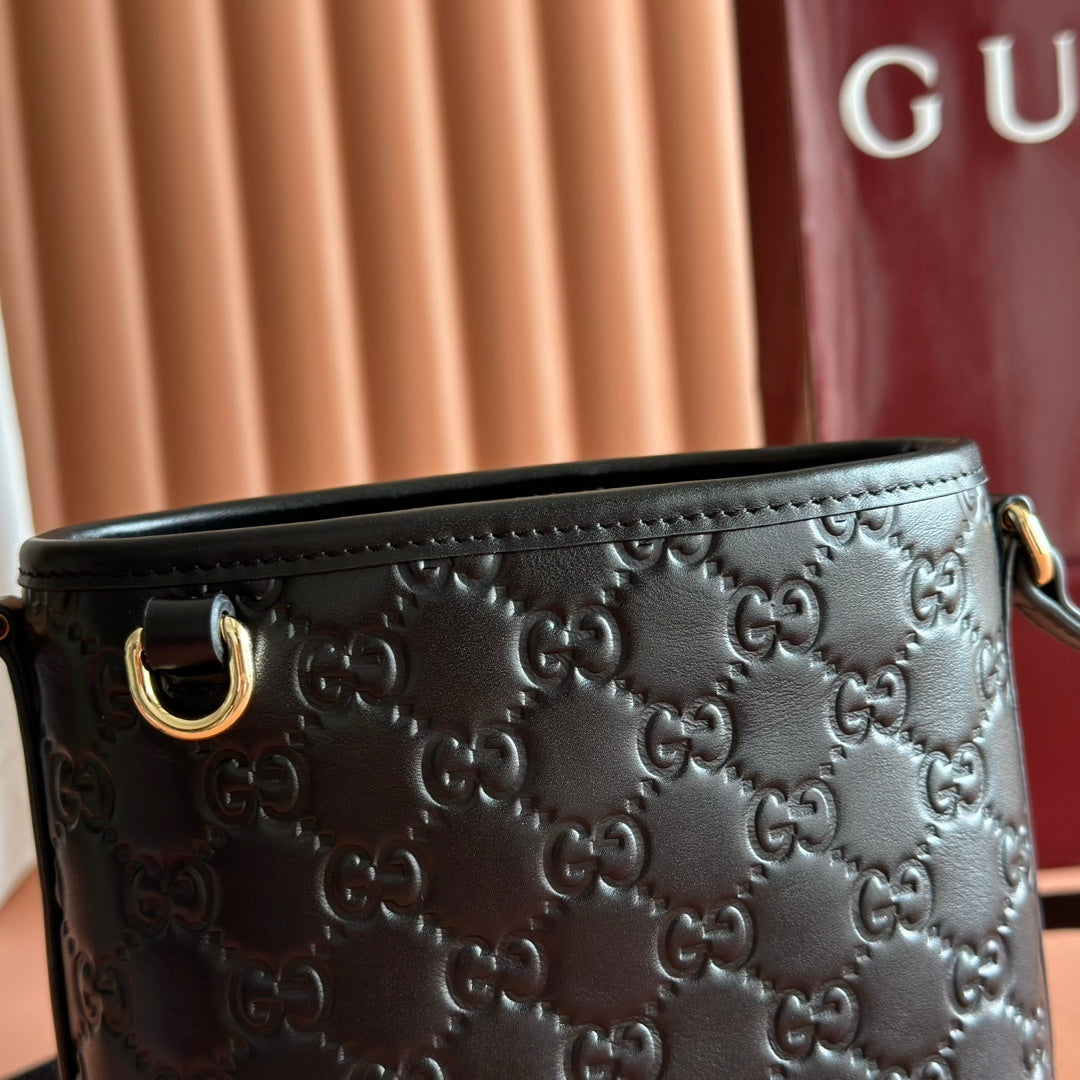 Gucci Small GG Emblem Bucket Bag in Black Embossed Leather with Dog Charm