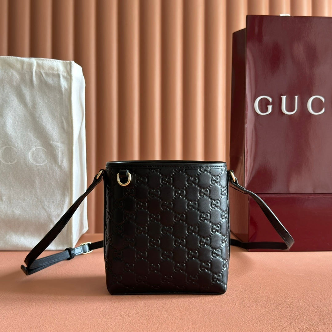 Gucci Small GG Emblem Bucket Bag in Black Embossed Leather with Dog Charm