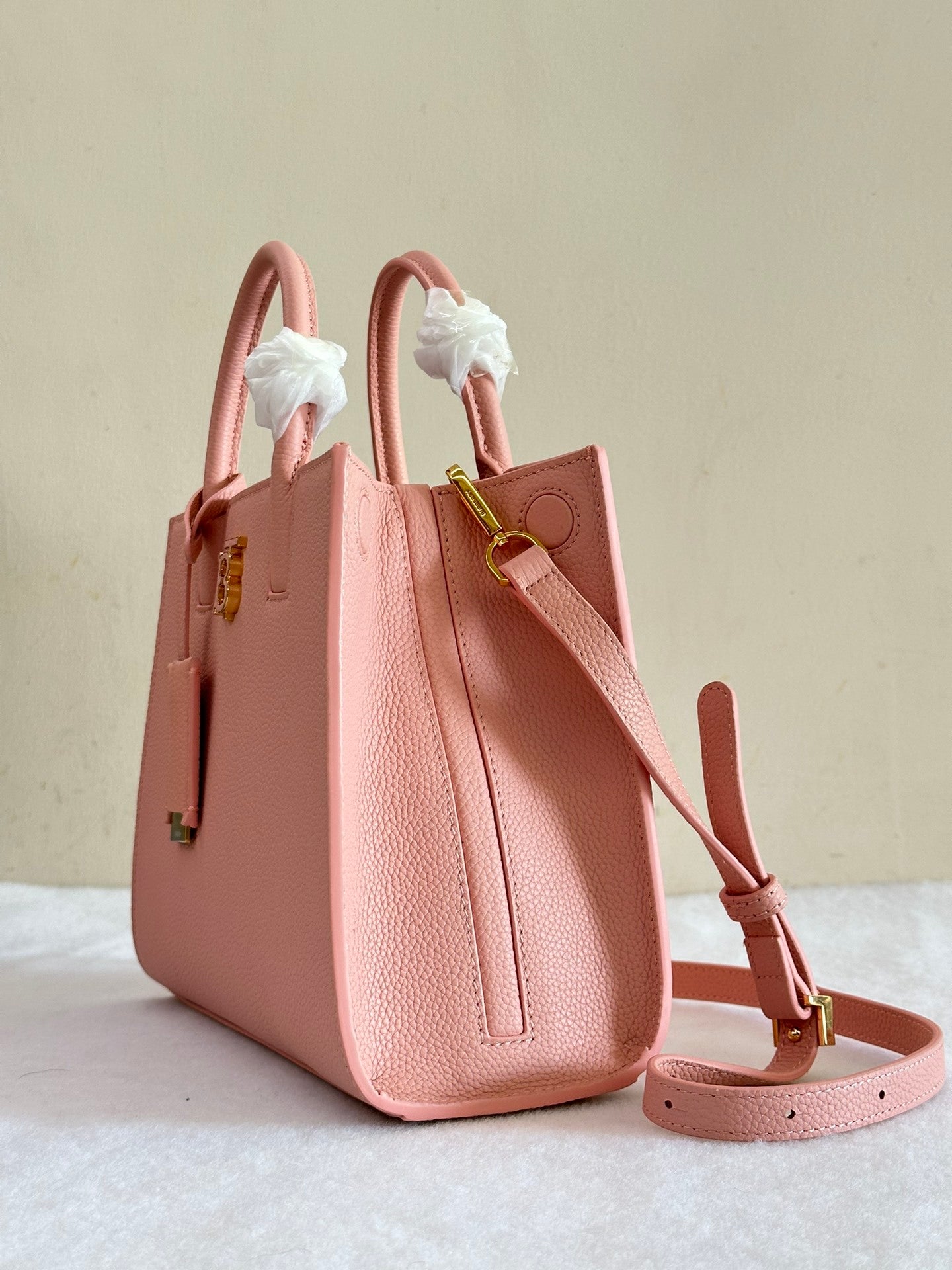 This is a Burberry Mini Frances Bag in dusky pink grainy leather, featuring the Thomas Burberry monogram in gold-tone hardware.