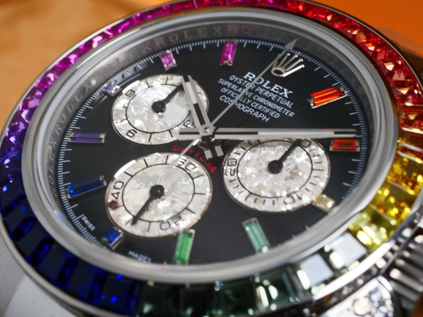 Rolex Oyster Perpetual Cosmograph Daytona White Gold, Diamond-Paved Dial, Rainbow Baguette Sapphire Bezel