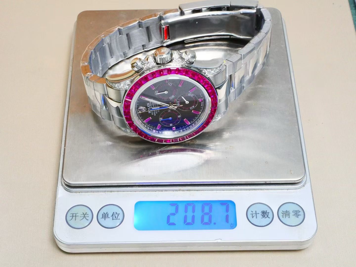 Rolex Cosmograph Daytona – 18K White Gold, Black Dial, Ruby Bezel & Diamond Lugs