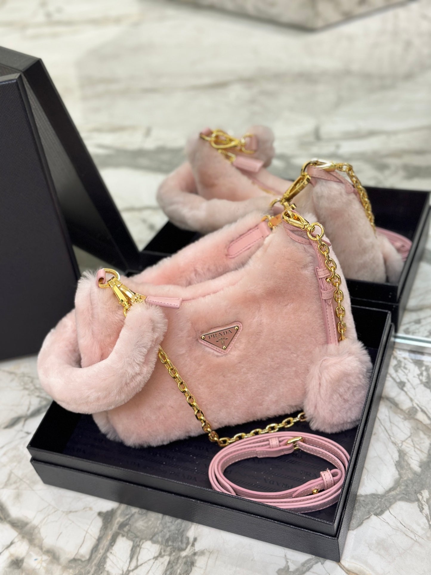 Prada Re-Edition Shearling Mini Bag – Pink with Gold-Tone Chain Strap & Enamel Logo