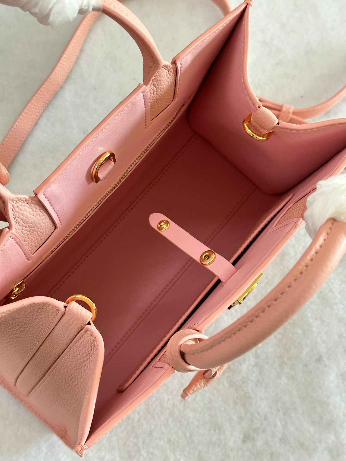 This is a Burberry Mini Frances Bag in dusky pink grainy leather, featuring the Thomas Burberry monogram in gold-tone hardware.