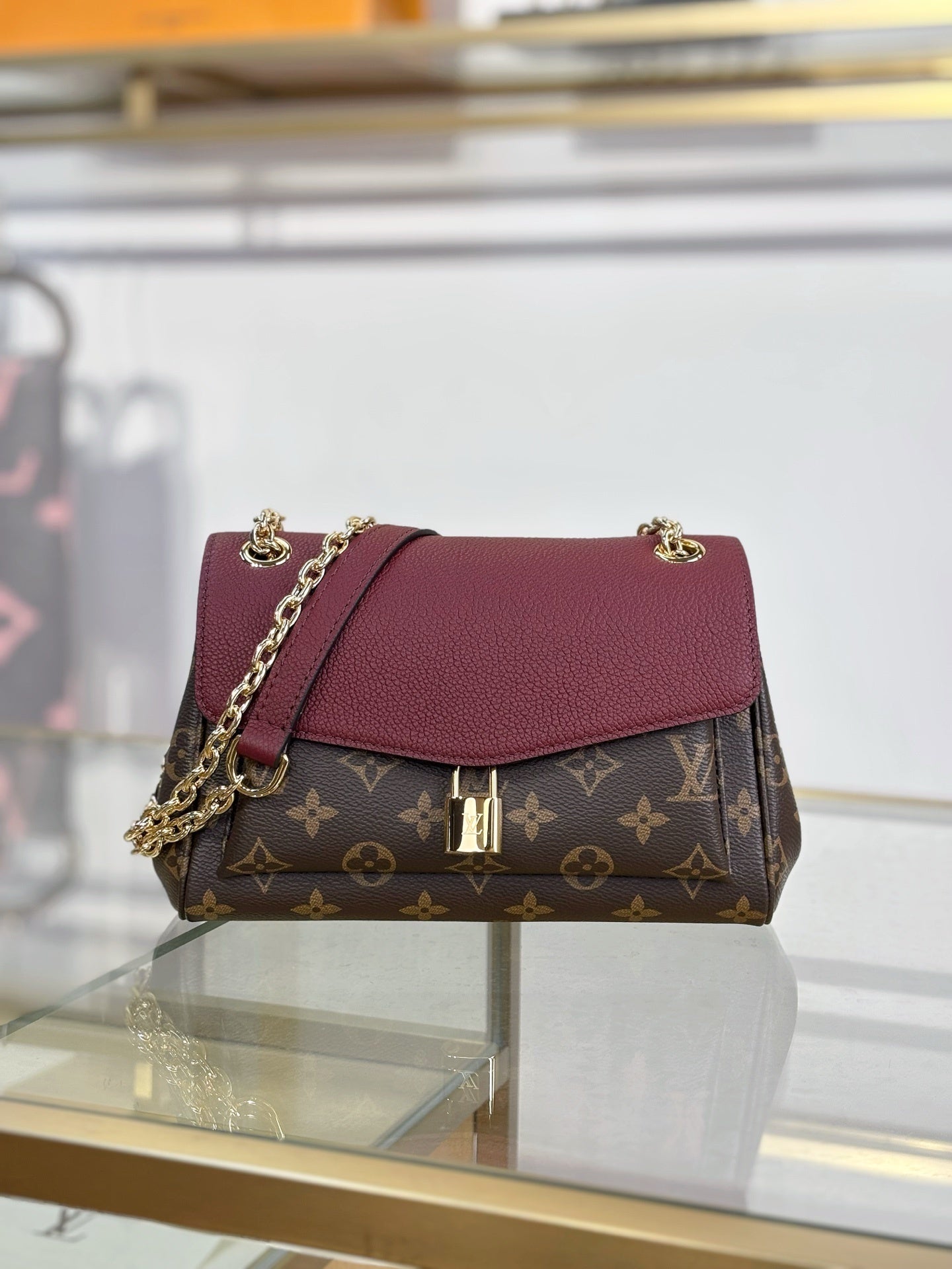Louis Vuitton Saint Germain BB Bag in Monogram Canvas with Red Leather Trim & Gold Chain Padlock