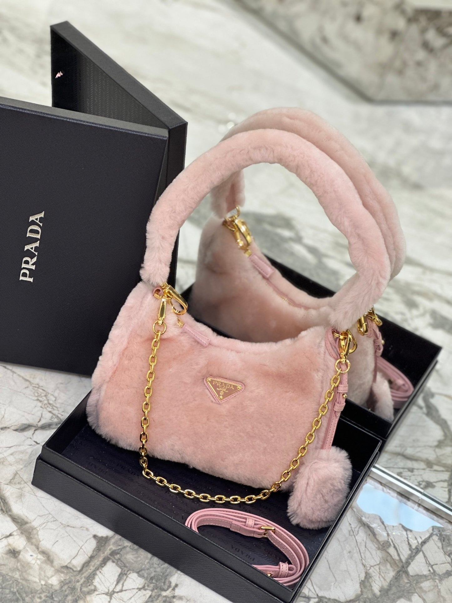 Prada Re-Edition Shearling Mini Bag – Pink with Gold-Tone Chain Strap & Enamel Logo