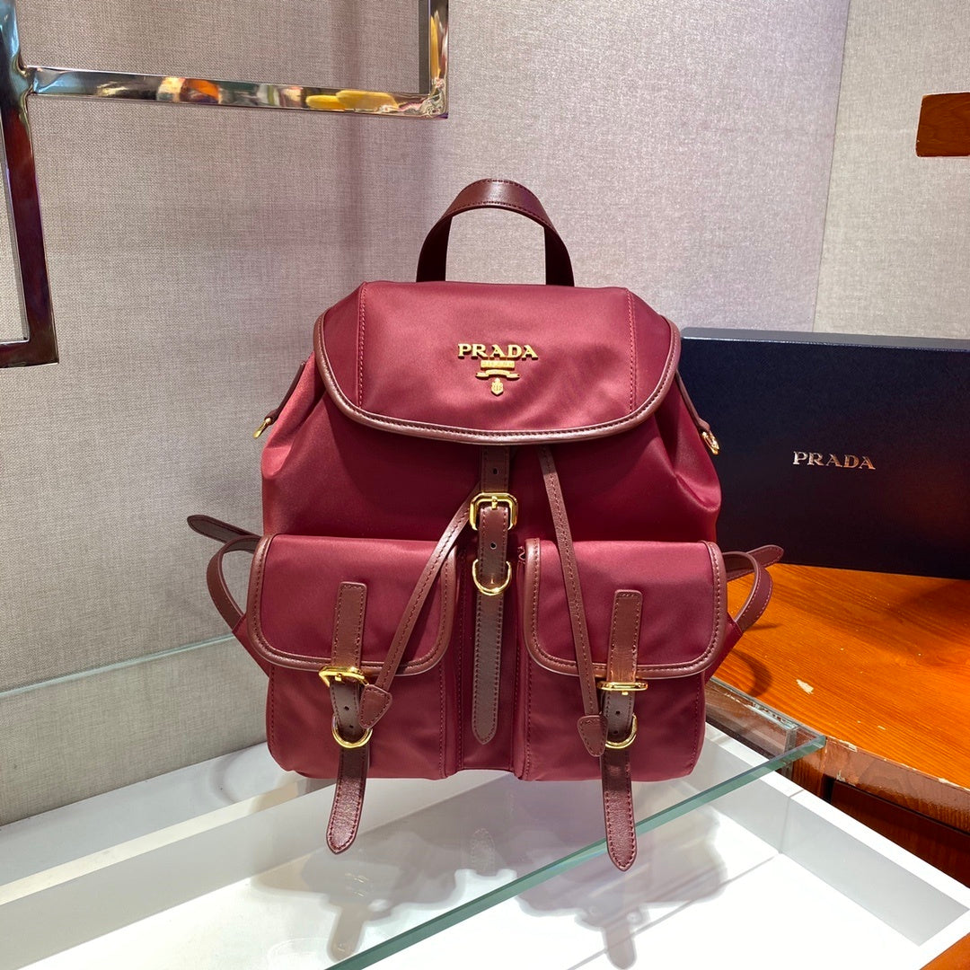 Prada Small Re-Nylon Backpack – Burgundy Red with Saffiano Leather Trim & Gold-Tone Hardware