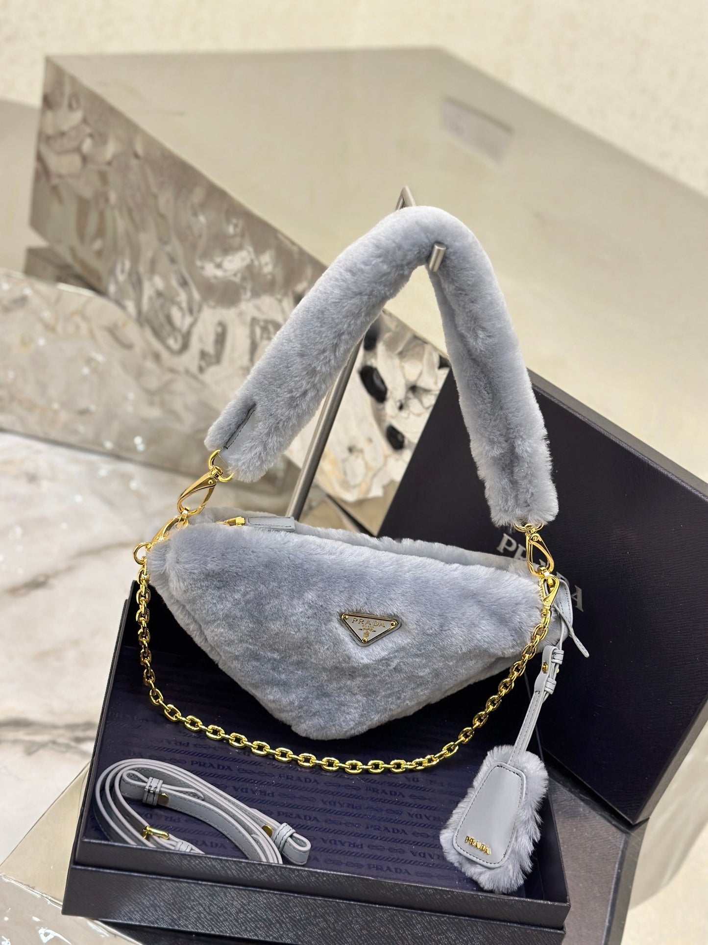 Prada Re-Edition Mini Shearling Triangle Crossbody Bag – Grey