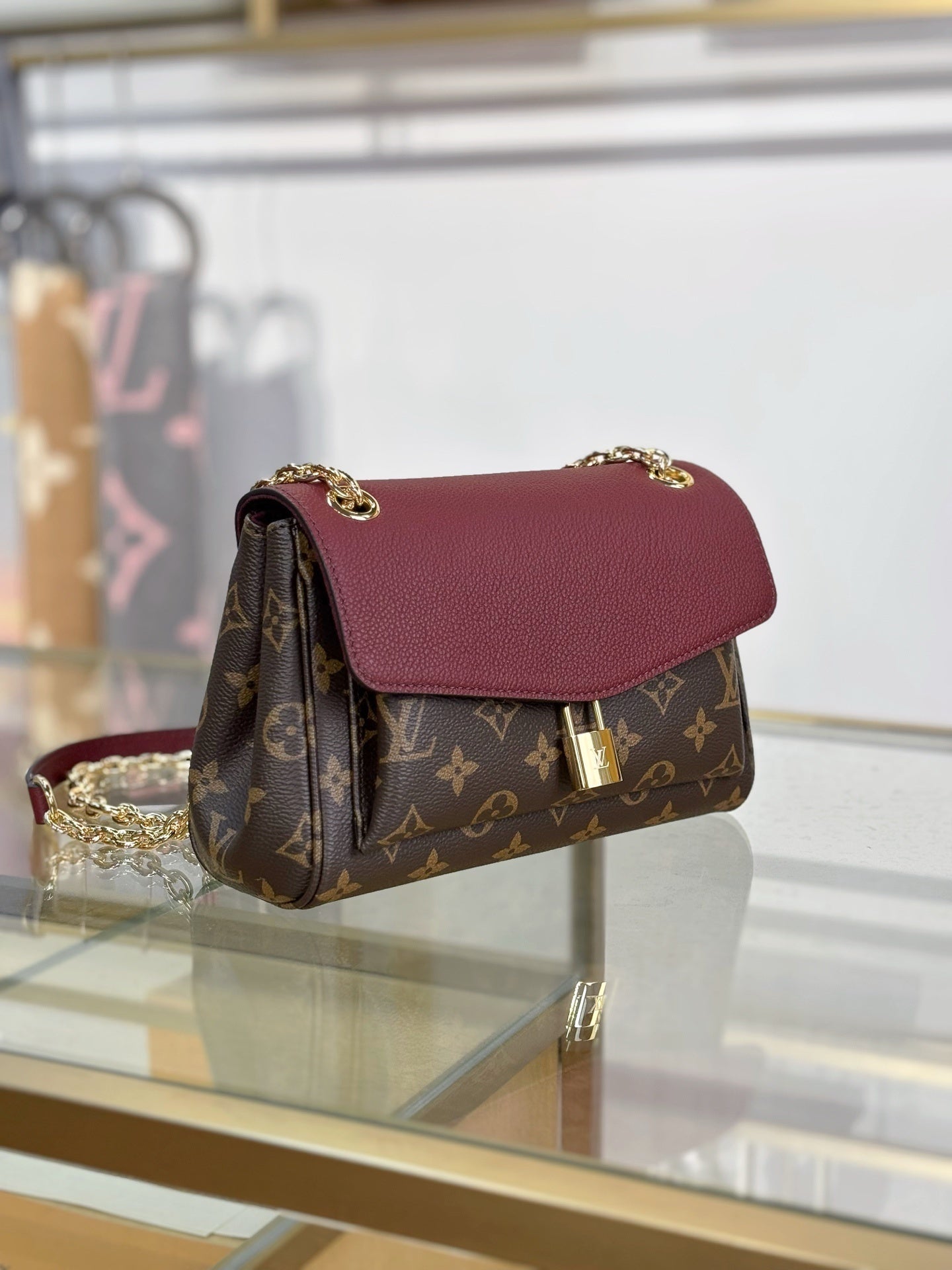 Louis Vuitton Saint Germain BB Bag in Monogram Canvas with Red Leather Trim & Gold Chain Padlock