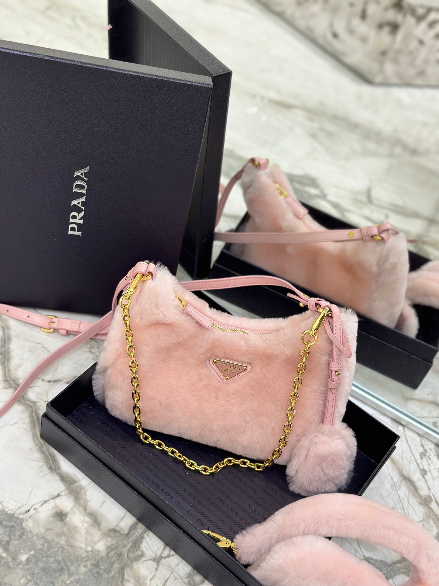 Prada Re-Edition Shearling Mini Bag – Pink with Gold-Tone Chain Strap & Enamel Logo