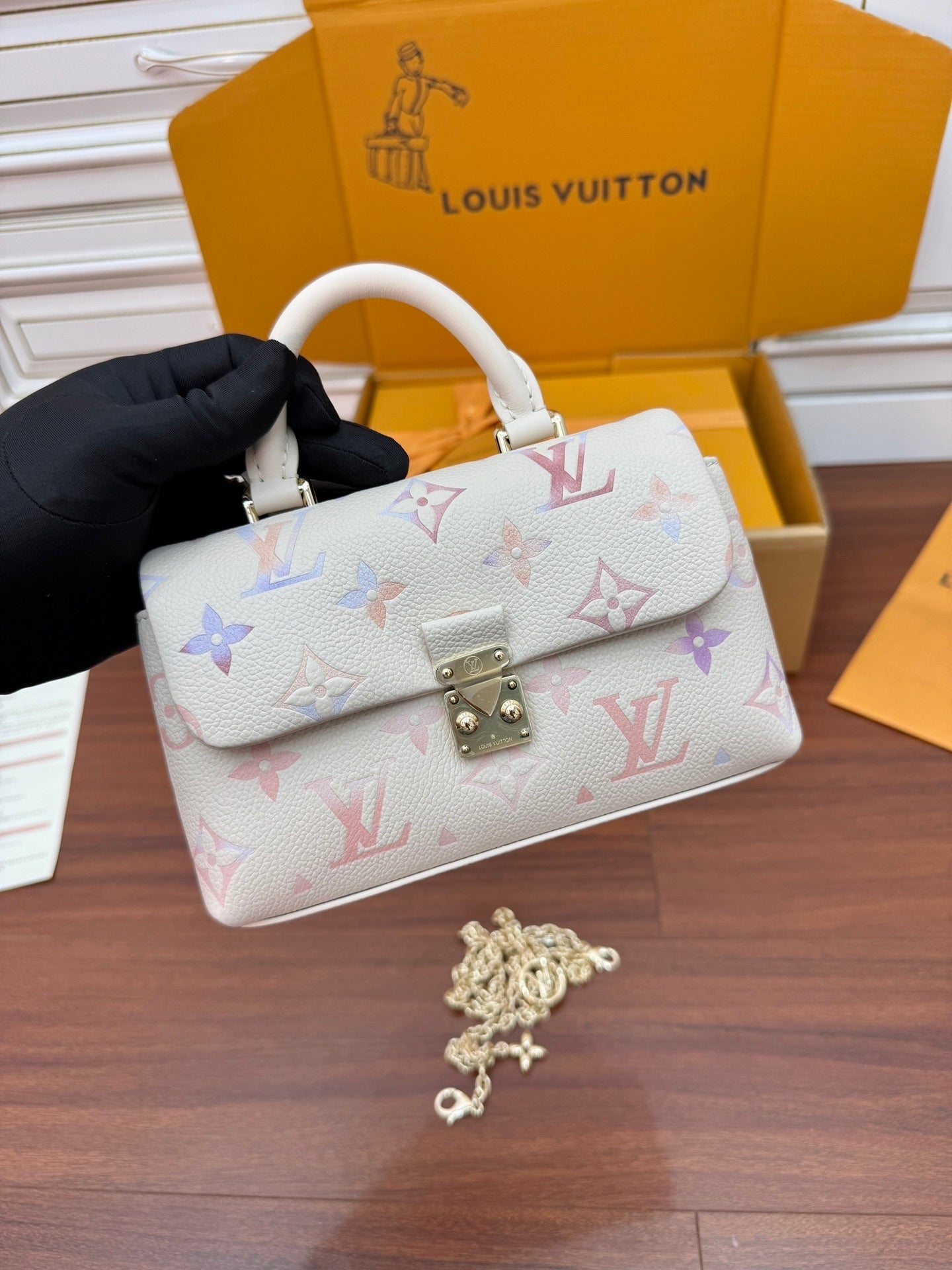 Louis Vuitton Nano Madeleine bag in the seasonal Snowy Pearl colorway, crafted from Monogram Empreinte leather.