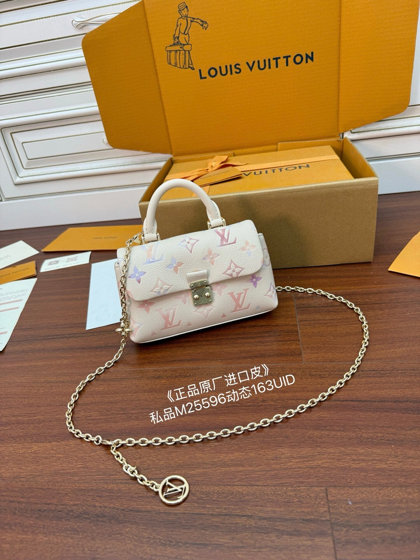 Louis Vuitton Nano Madeleine bag in the seasonal Snowy Pearl colorway, crafted from Monogram Empreinte leather.