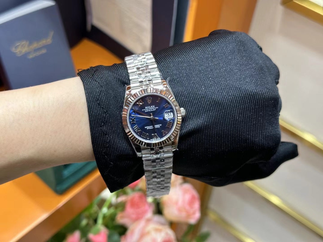 Rolex Datejust – Blue Dial with Roman Numerals, White Gold Fluted Bezel & Steel Jubilee Bracelet