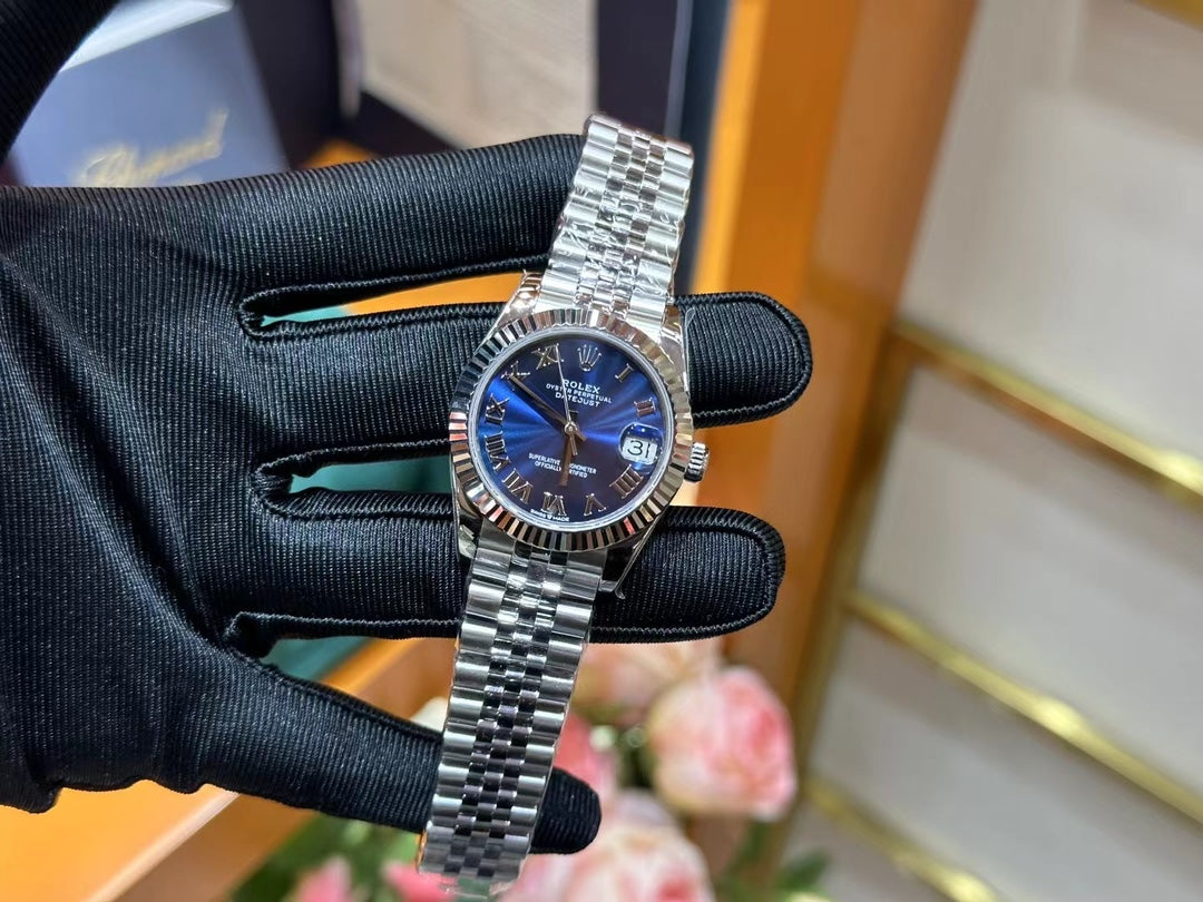 Rolex Datejust – Blue Dial with Roman Numerals, White Gold Fluted Bezel & Steel Jubilee Bracelet