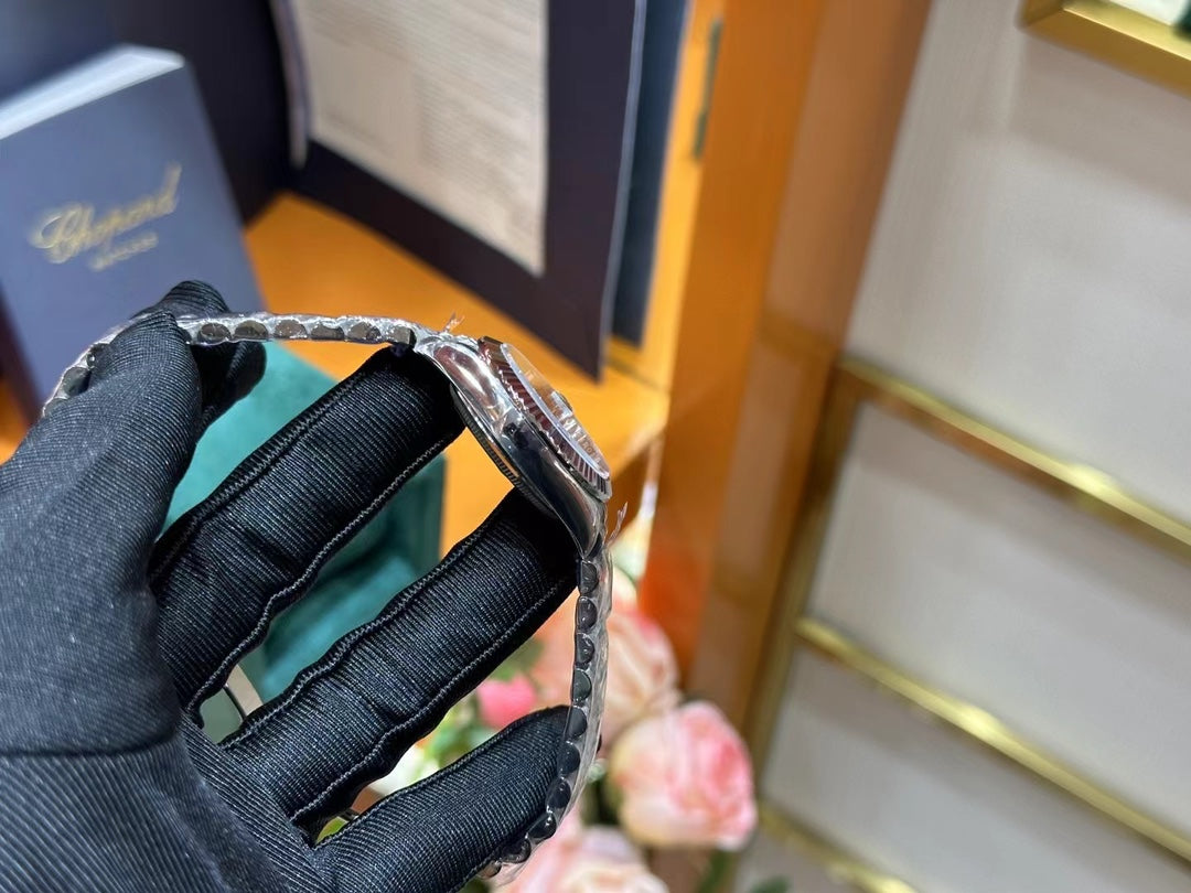 Rolex Datejust – Blue Dial with Roman Numerals, White Gold Fluted Bezel & Steel Jubilee Bracelet